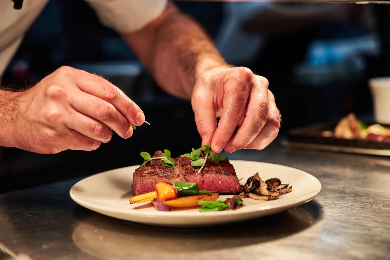 Portsmouth NH restaurant chef plating a dish made with same-day harvested local farm ingredients